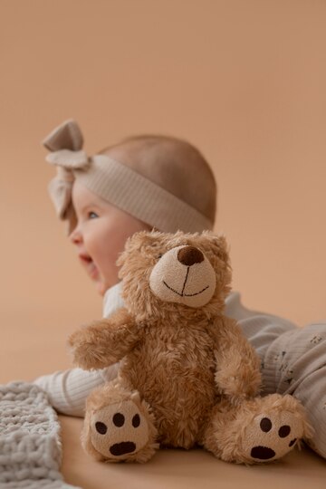 cute-baby-with-stuffed-animal_23-2150573645